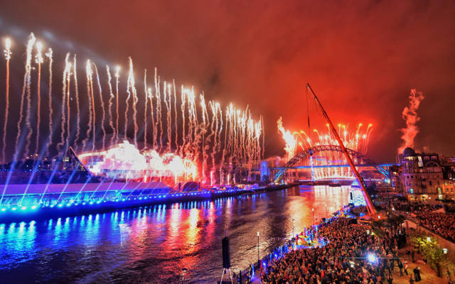 Great North Star - A large crowd on the banks of the River Tyne watching a fireworks display.